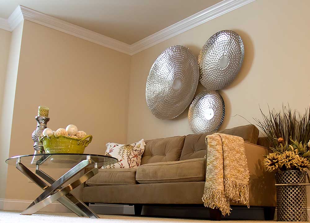 Living room with couch and metal wall art